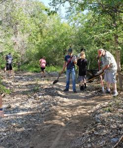 Volunteers assisting with trail work